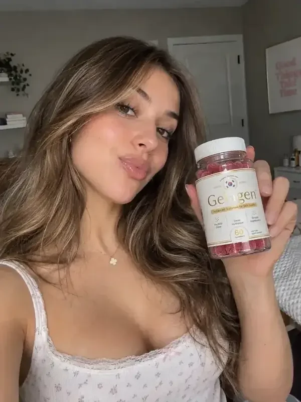 Woman holding a bottle of Gelagen gummies